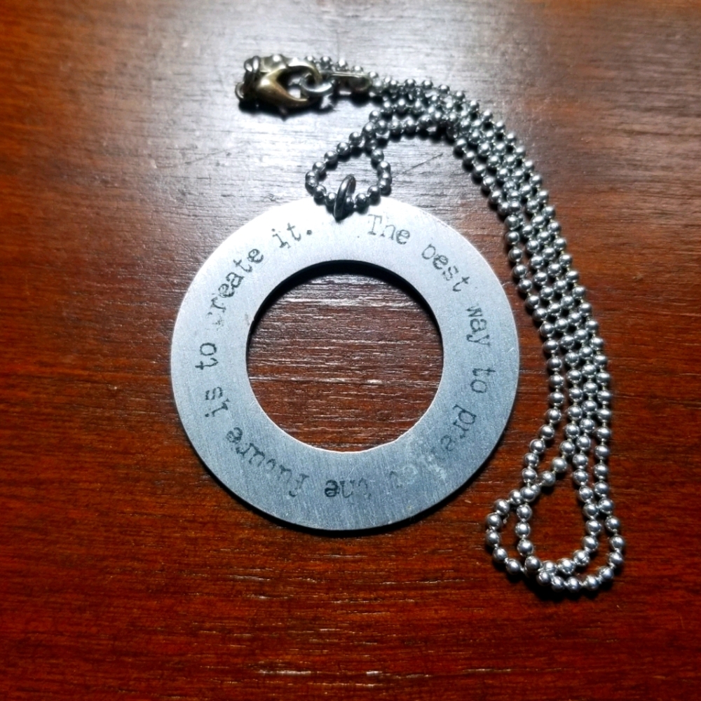 Metal disc motto pendant necklace